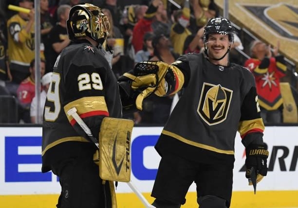 Nick Holden and Marc-Andre Fleury of the Vegas Golden Knights celebrate after a goal by Mattias Janmark during the second period against the Montreal...