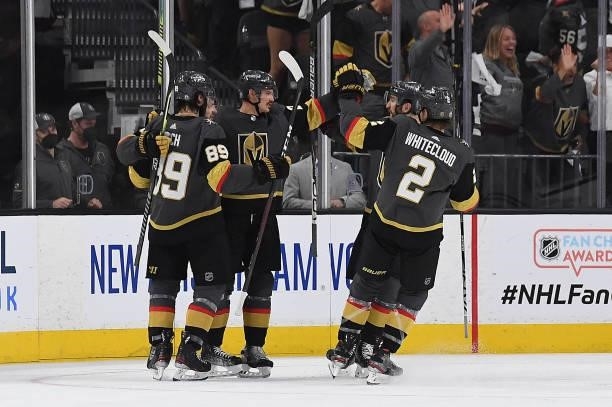 Mattias Janmark of the Vegas Golden Knights celebrates with teammates after scoring a goal during the second period against the Montreal Canadiens in...