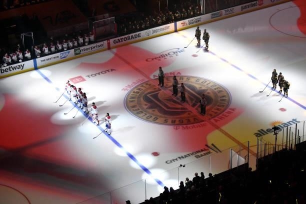 The Montreal Canadiens and Vegas Golden Knights stand for the national anthems prior to Game One of the Stanley Cup Semifinals at T-Mobile Arena on...