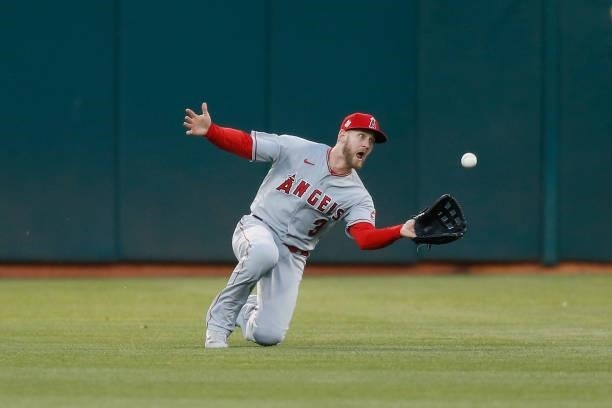 Taylor Ward of the Los Angeles Angels makes a sliding catch to get the out of Matt Chapman of the Oakland Athletics in the bottom of the fourth...