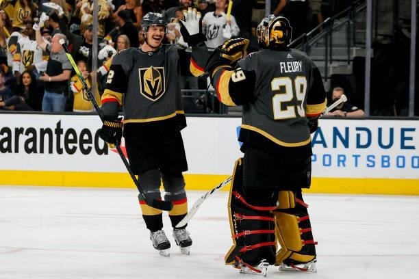 Nick Holden of the Vegas Golden Knights is congratulated by Marc-Andre Fleury after scoring a goal against the Montreal Canadiens during the third...
