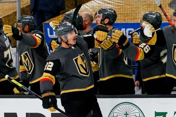 Nick Holden of the Vegas Golden Knights is congratulated by his teammates after scoring a goal against the Montreal Canadiens during the third period...