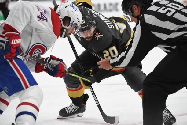 Chandler Stephenson of the Vegas Golden Knights faces off with Phillip Danault of the Montreal Canadiens during the third period in Game One of the...