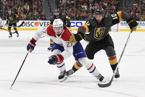 Nicolas Roy of the Vegas Golden Knights battles Alexander Romanov of the Montreal Canadiens during the third period in Game One of the Stanley Cup...