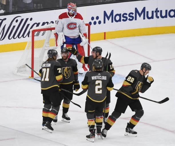 William Karlsson, Jonathan Marchessault, Zach Whitecloud, and Reilly Smith of the Vegas Golden Knights celebrate a goal by Nick Holden during the...