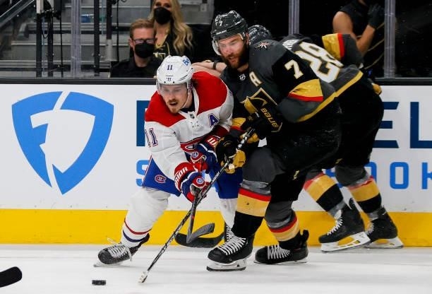 Brendan Gallagher of the Montreal Canadiens and Alex Pietrangelo of the Vegas Golden Knights battle for the puck during the third period in Game One...