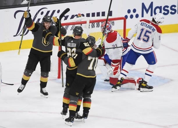 Nick Holden of the Vegas Golden Knights celebrates with Jonathan Marchessault and William Karlsson after scoring a goal in the third period against...