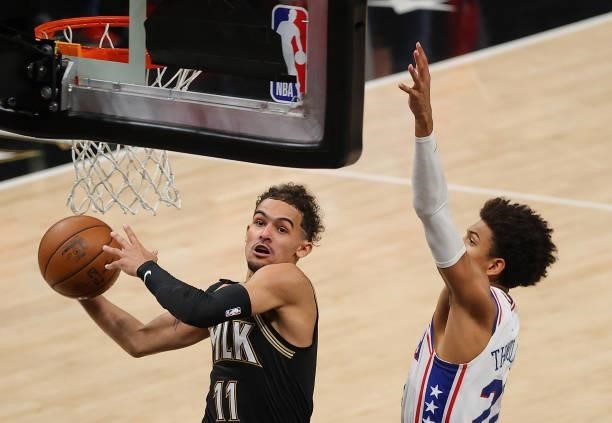 Trae Young of the Atlanta Hawks drives against Matisse Thybulle of the Philadelphia 76ers during the second half of game 4 of the Eastern Conference...
