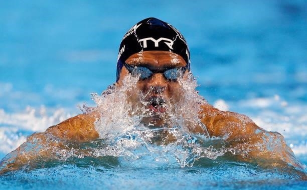 Michael Andrew of the United States competes in the Men’s 100m breaststroke final during Day Two of the 2021 U.S. Olympic Team Swimming Trials at CHI...