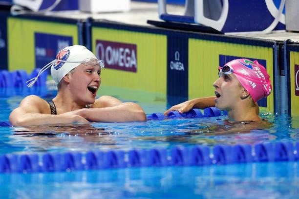 Phoebe Bacon and Regan Smith of the United States react after competing in a semifinal heat for the Women’s 100m backstroke during Day Two of the...