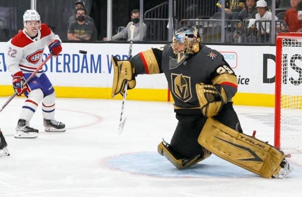 Cole Caufield of the Montreal Canadiens looks on as Marc-Andre Fleury of the Vegas Golden Knights blocks a shot in the third period in Game One of...