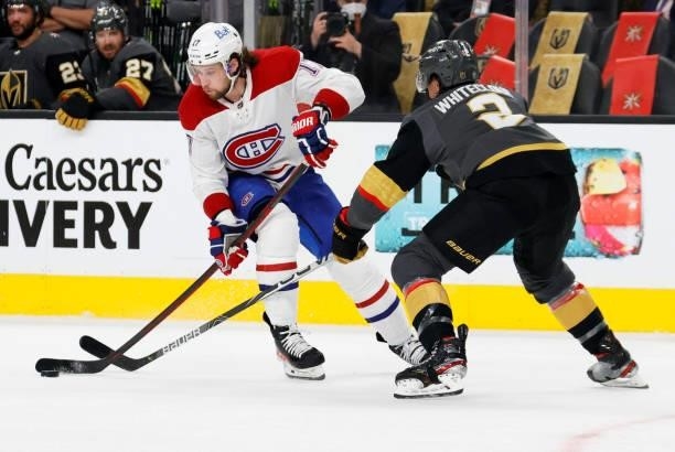 Josh Anderson of the Montreal Canadiens skates with the puck against Zach Whitecloud of the Vegas Golden Knights in the first period in Game One of...