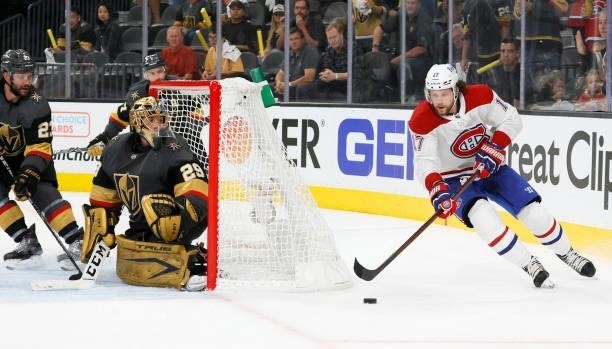 Josh Anderson of the Montreal Canadiens skates with the puck as Marc-Andre Fleury of the Vegas Golden Knights defends the net in the third period in...