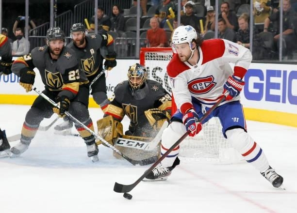 Josh Anderson of the Montreal Canadiens skates with the puck as Alec Martinez, Alex Pietrangelo and Marc-Andre Fleury of the Vegas Golden Knights...