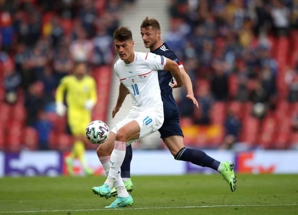 Patrik Schick of Czech Republic controls the ball from Liam Cooper of Scotland during the UEFA Euro 2020 Championship Group D match between Scotland...