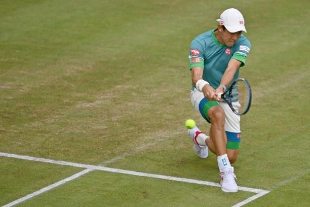 Kei Nishikori of Japan plays a backhand in his match against Ricardas Berkankis of Lithuania during day 4 of the Noventi Open at OWL-Arena on June...