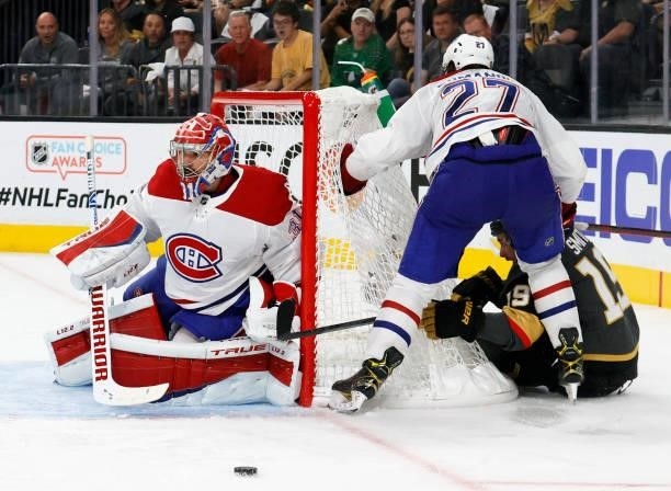 Carey Price of the Montreal Canadiens blocks a shot by Reilly Smith of the Vegas Golden Knights as Alexander Romanov of the Canadiens defends in the...