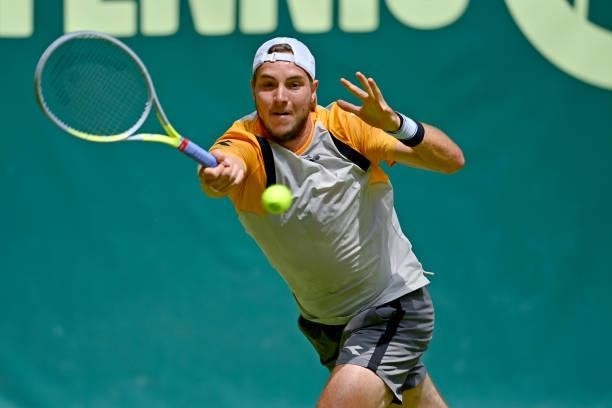 Jan-Lennard Struff of Germany plays a forehand in his match against Daniil Medvedev of Russia during day 4 of the Noventi Open at OWL-Arena on June...