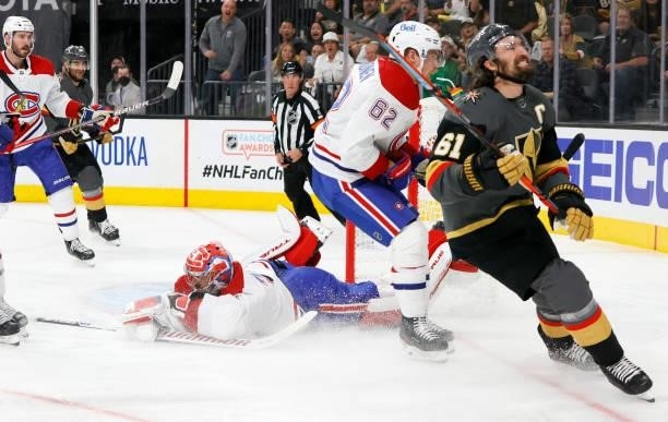 Carey Price of the Montreal Canadiens covers up the puck after making a save against Mark Stone of the Vegas Golden Knights as Artturi Lehkonen of...