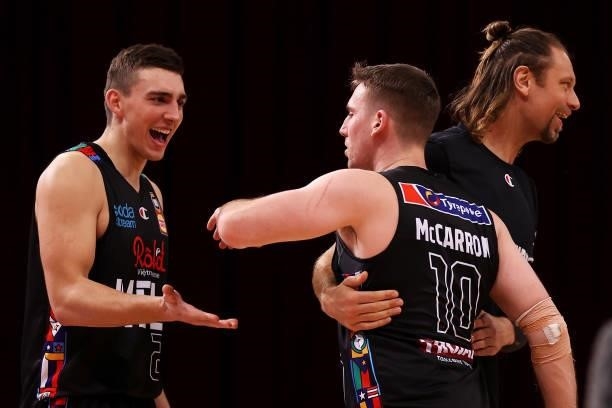 Mason Peatling, Mitch McCarron and David Anderson of Melbourne United celebrate victory during game three of the NBL Semi-Final Series between...