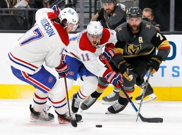Josh Anderson of the Montreal Canadiens takes a pass from teammate Brendan Gallagher as Alex Pietrangelo of the Vegas Golden Knights defends in the...