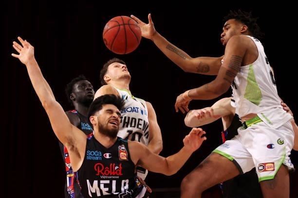 Sam McDaniel of Melbourne United has his shot blocked by Ben Moore of the Phoenix during game three of the NBL Semi-Final Series between Melbourne...