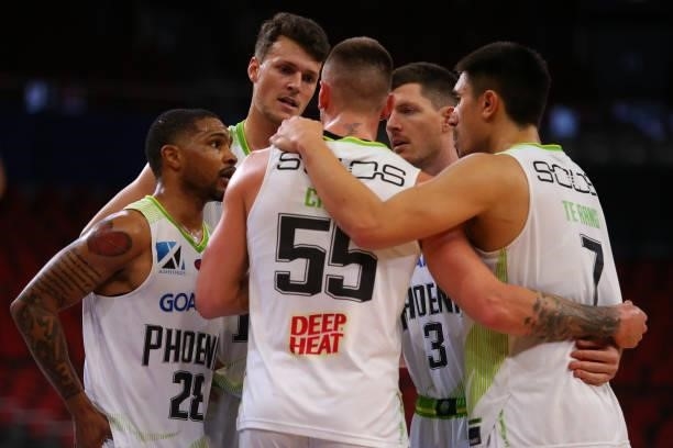 Phoenix players form a huddle during game three of the NBL Semi-Final Series between Melbourne United and the South East Melbourne Phoenix at Qudos...