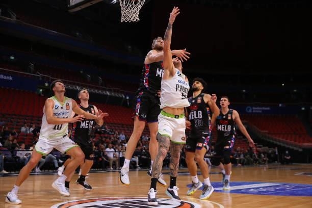 Jock Landale of United and Mitch Creek of the Phoenix compete for the ball during game three of the NBL Semi-Final Series between Melbourne United...