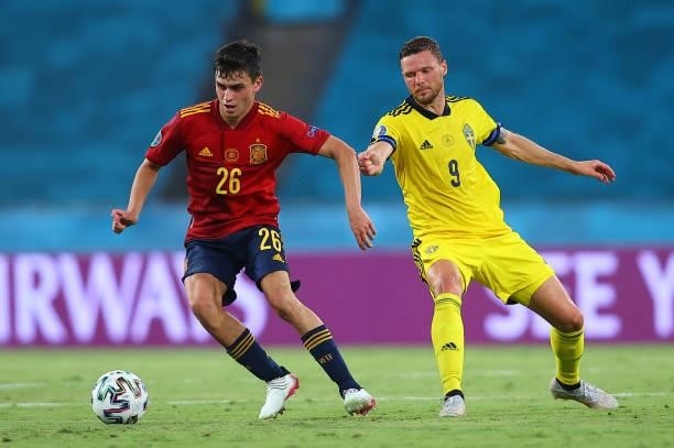 Pedri of Spain competes for the ball with Marcus Berg of Sweden during the UEFA Euro 2020 Championship Group E match between Spain and Sweden at the...