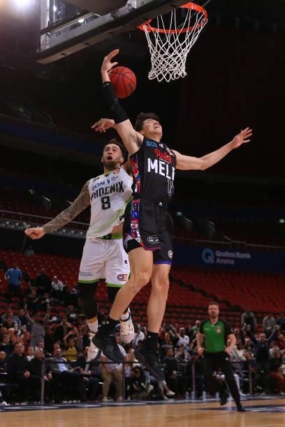 Yudai Baba of United drives to the basket under pressure from Izayah Mauriohooho-Le'afa of the Phoenix during game three of the NBL Semi-Final Series...