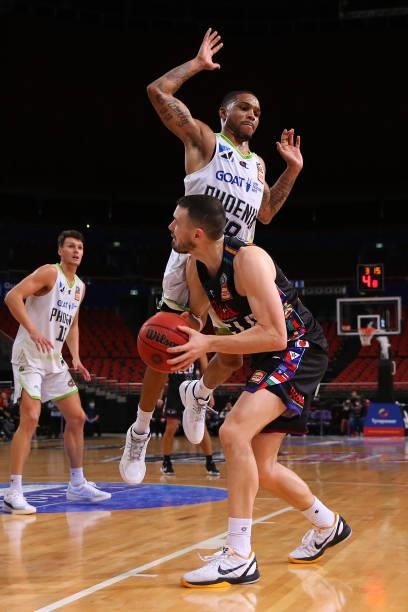 Chris Goulding of United drives to the basket under pressure from Keifer Sykes of the Phoenix during game three of the NBL Semi-Final Series between...