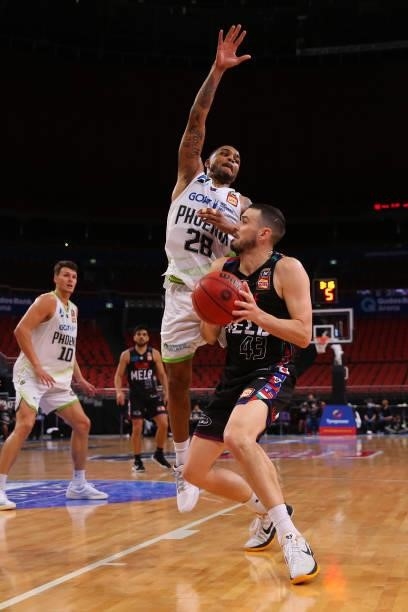Chris Goulding of United drives to the basket under pressure from Keifer Sykes of the Phoenix during game three of the NBL Semi-Final Series between...