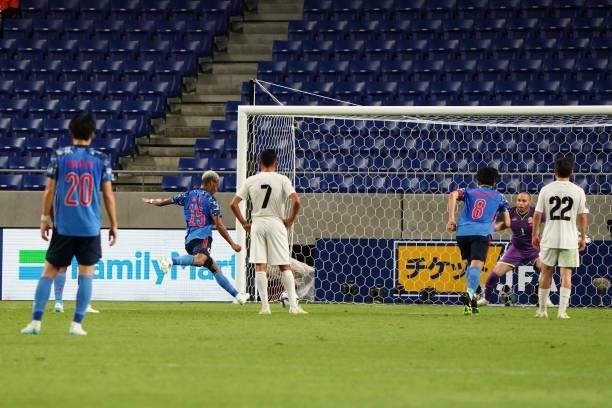 Ado Onaiwu of Japan converts the penalty to score his side's first goal during the FIFA World Cup Asian Qualifier second round Group F match between...