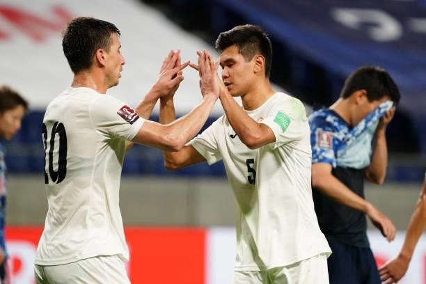 Mirlan Murzaev of Kyrgyz reacts after scoring his side's first goal with his team mate Aizar Akmatov during the FIFA World Cup Asian Qualifier second...