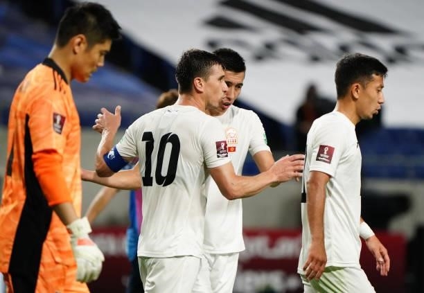 Mirlan Murzaev of Kyrgyz reacts after scoring his side's first goal with his team mates during the FIFA World Cup Asian Qualifier second round Group...