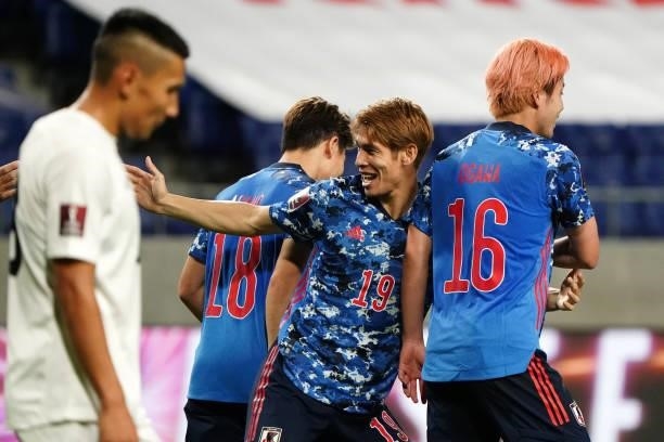 Sho Sasaki of Japan celebrates scoring his side's fourth goal with his team mates during the FIFA World Cup Asian Qualifier second round Group F...