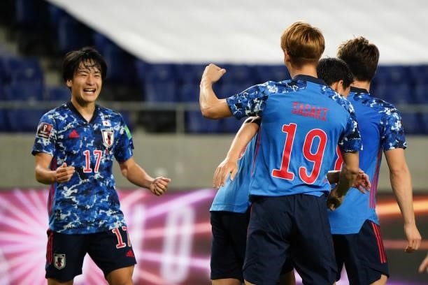 Sho Sasaki of Japan celebrates scoring his side's fourth goal with his team mate during the FIFA World Cup Asian Qualifier second round Group F match...