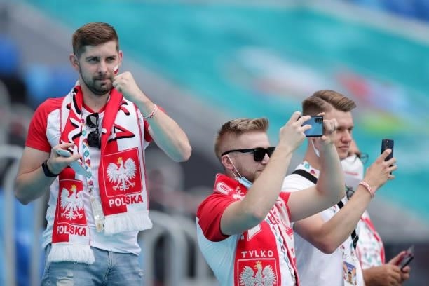 Fans of Poland cheer their team as they warm up before the UEFA Euro 2020 Championship Group E match between Poland and Slovakia on June 14, 2021 in...