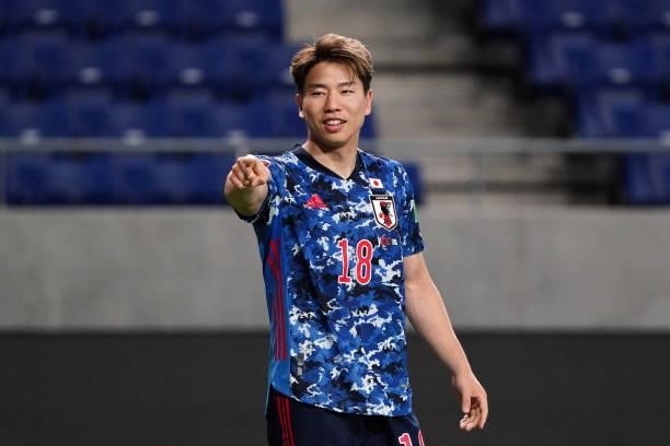 Takuma Asano of Japan celebrates scoring his side's fifth goal during the FIFA World Cup Asian Qualifier second round Group F match between Japan and...