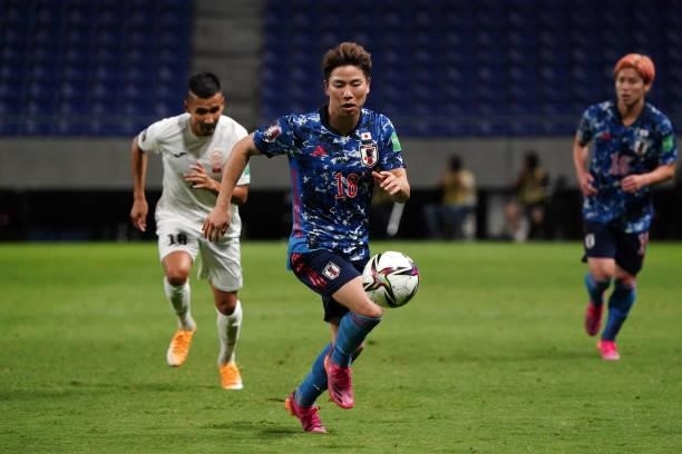 Takuma Asano of Japan in action during the FIFA World Cup Asian Qualifier second round Group F match between Japan and Kyrgyz at Panasonic Stadium...