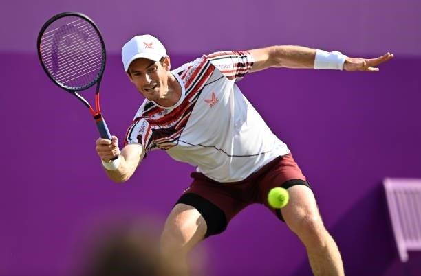 Andy Murray of Great Britain stretches to play a forehand during his First Round match against Benoît Paire of France during Day 2 of the cinch...