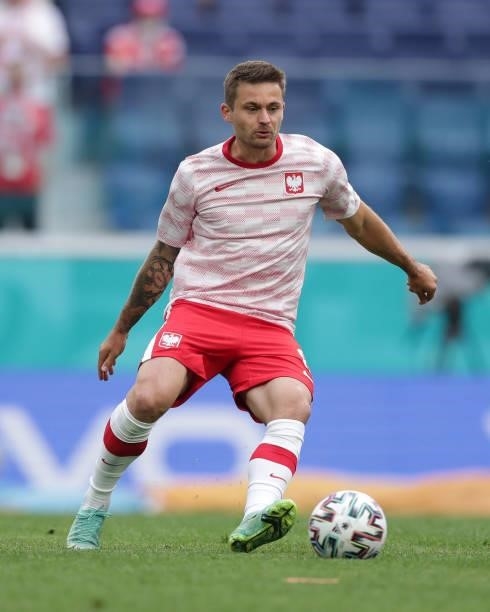 Karol Linetty of Poland warms up before the UEFA Euro 2020 Championship Group E match between Poland and Slovakia on June 14, 2021 in Saint...