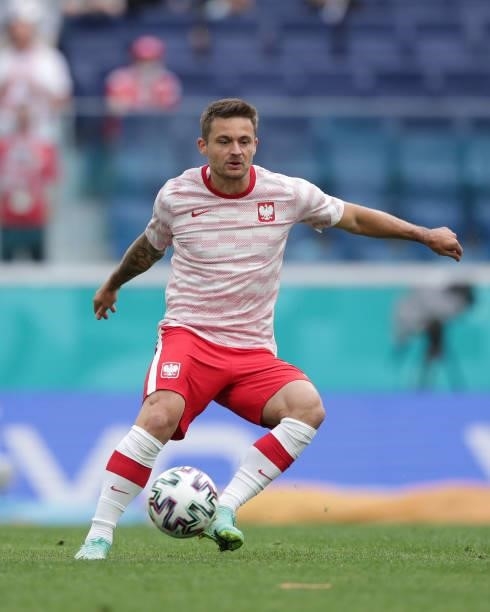 Karol Linetty of Poland warms up before the UEFA Euro 2020 Championship Group E match between Poland and Slovakia on June 14, 2021 in Saint...