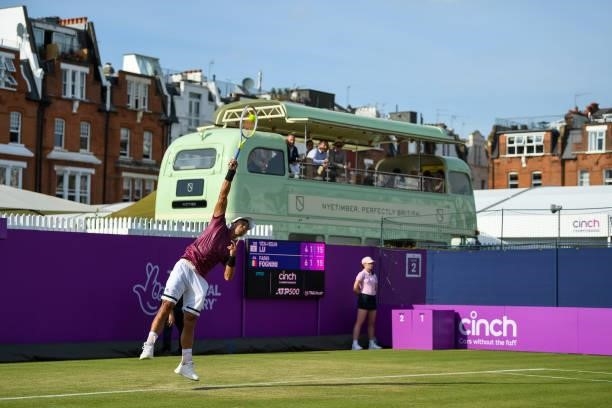 Yen-Hsun Lu of Taiwan serves during his First Round match against Fabio Fognini of Italy during Day 2 of the cinch Championships at The Queen's Club...