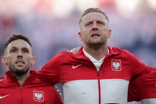 Maciej Rybus and his teammate Kamil Glik of Poland sing their national anthem prior to start during the UEFA Euro 2020 Championship Group E match...