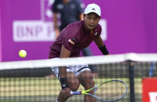 Yen-Hsun Lu of Taiwan plays a backhand during his First Round match against Fabio Fognini of Italy during Day 2 of the cinch Championships at The...