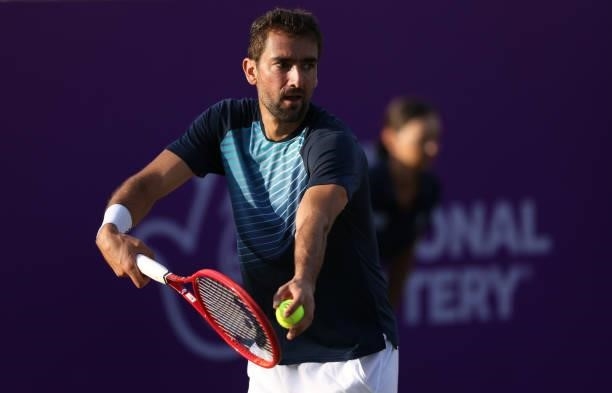 Marin Čilić of Croatia serves during his First Round match against Sebastian Ofner of Austria during Day 2 of the cinch Championships at The Queen's...