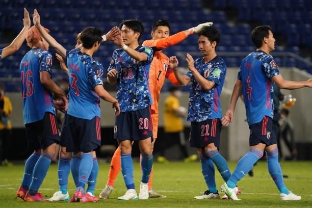 Players of Japan celebrate their 5-1 victory at the end of the FIFA World Cup Asian Qualifier 2nd round Group F match between Japan and Kyrgyz at...