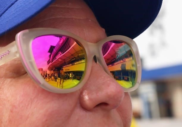With the arena reflected in her sunglasses, Kelly Smith of Riverview waits in the plaza for the start of the game between the Tampa Bay Lightning and...