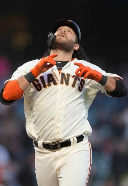 Brandon Crawford of the San Francisco Giants celebrates after hitting a two-run home run against the Arizona Diamondbacks in the bottom of the fifth...
